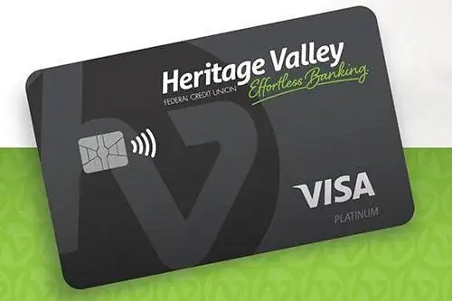Dark grey credit card with black "HV" logo. Heritage Valley Federal Credit Union. Effortless Banking. Visa. Platinum.