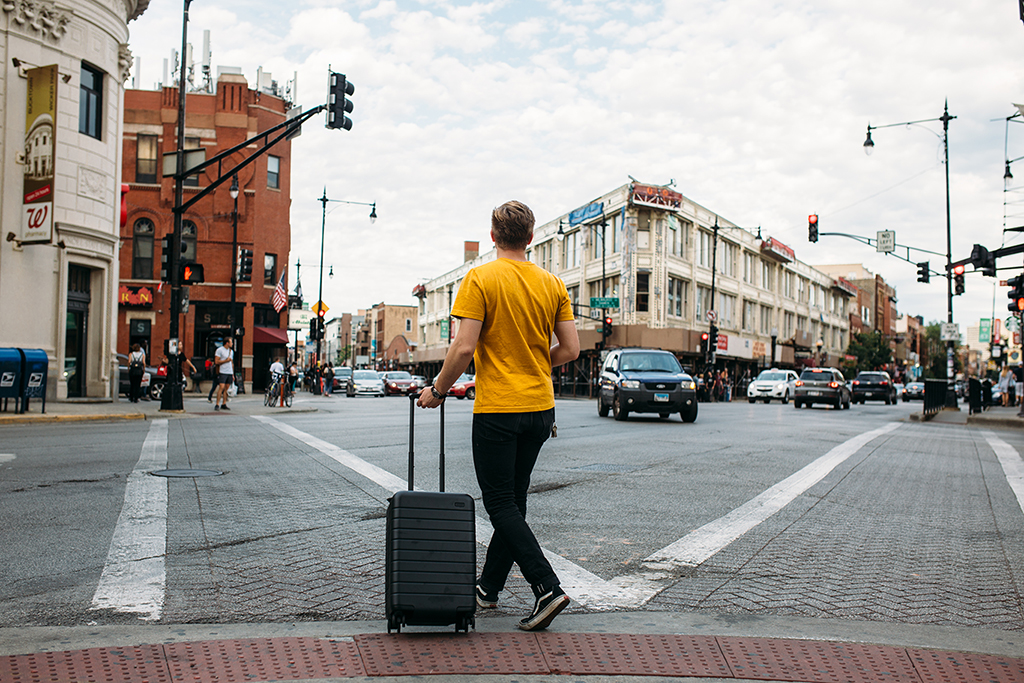 Young Man Traveling with suitcase