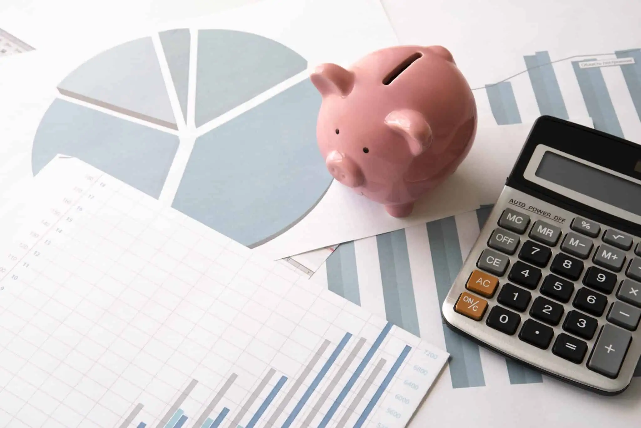 Financial Planning with calculator and piggy bank