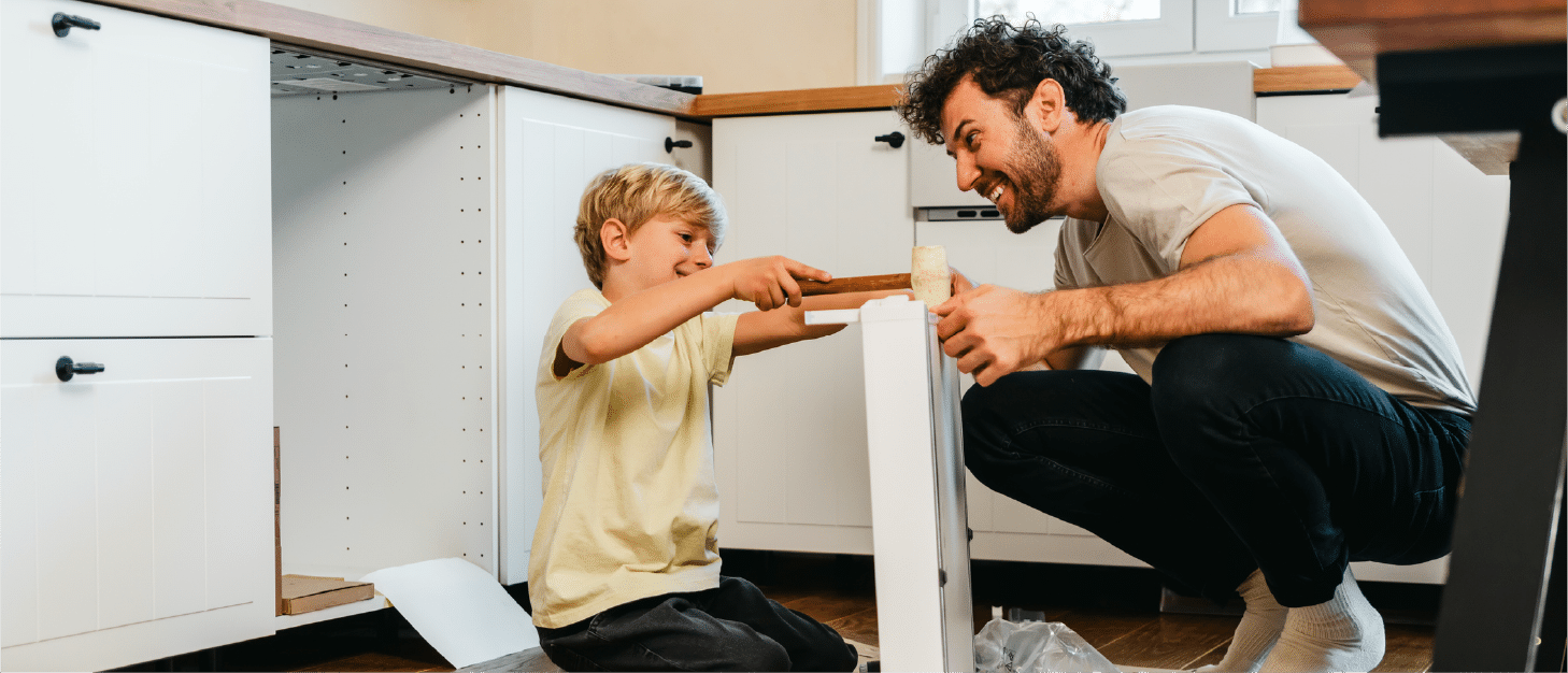 father and son working on kitchen