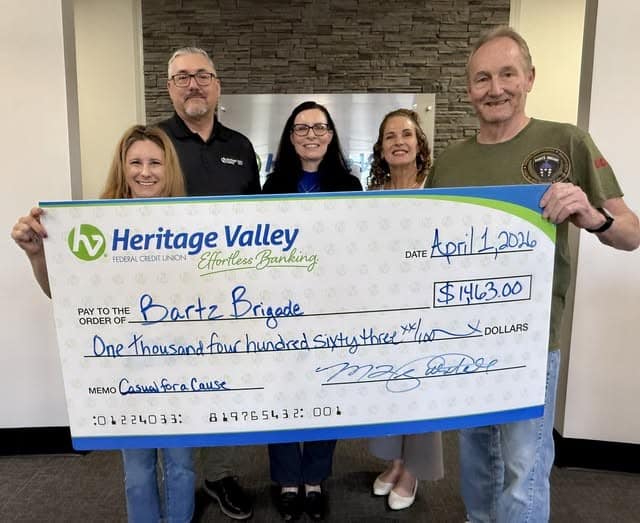 Heritage team presenting check