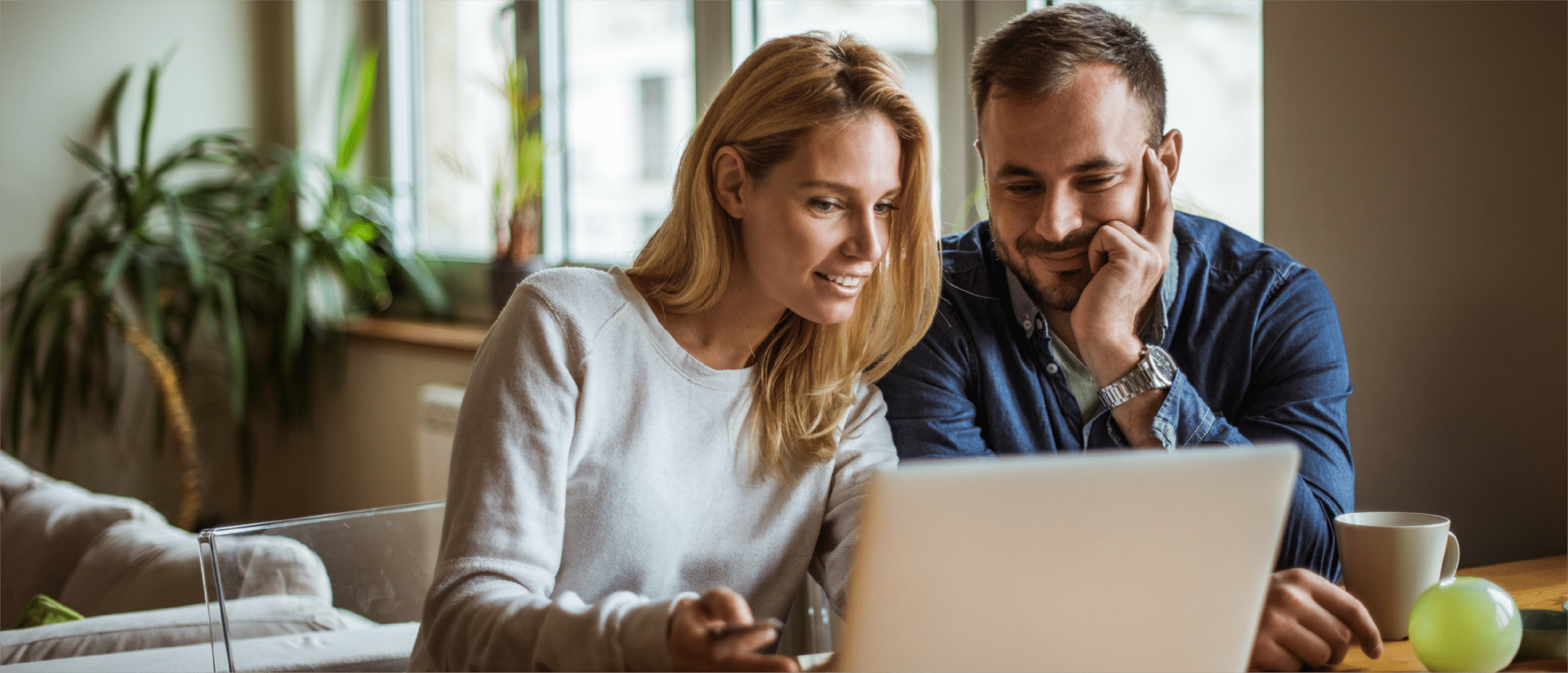 Couple doing banking on laptop