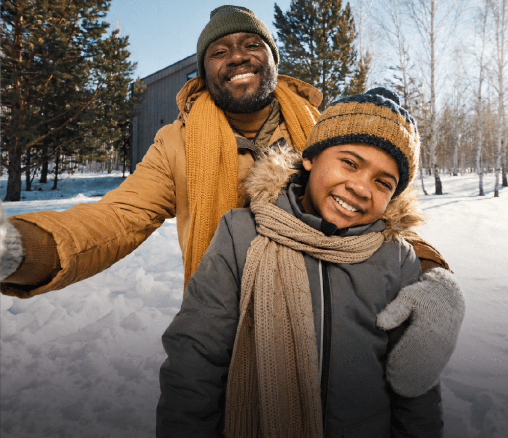 Father and child playing in snow